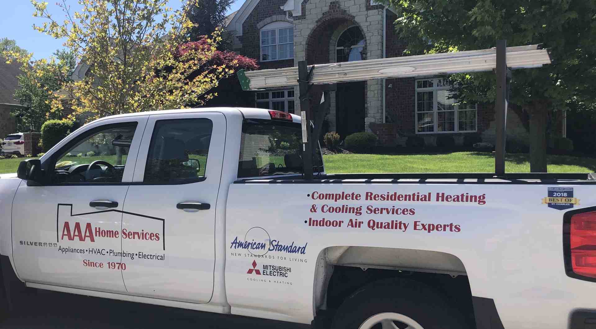 Close-up of a modern, high-efficiency outdoor AC unit next to a home - air conditioner replacement near me Close-up of a modern, high-efficiency outdoor AC unit next to a home - air conditioner replacement near me
