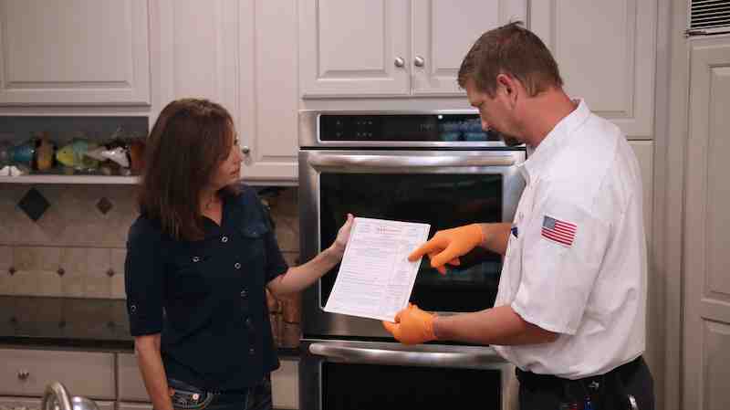 technician checking AC system with multimeter - ac maintenance technician checking AC system with multimeter - ac maintenance