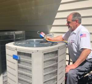 Why Choose AAA Home Services as Your Go-To for Comfort and Efficiency 3 AAA Professional performing a furnace check