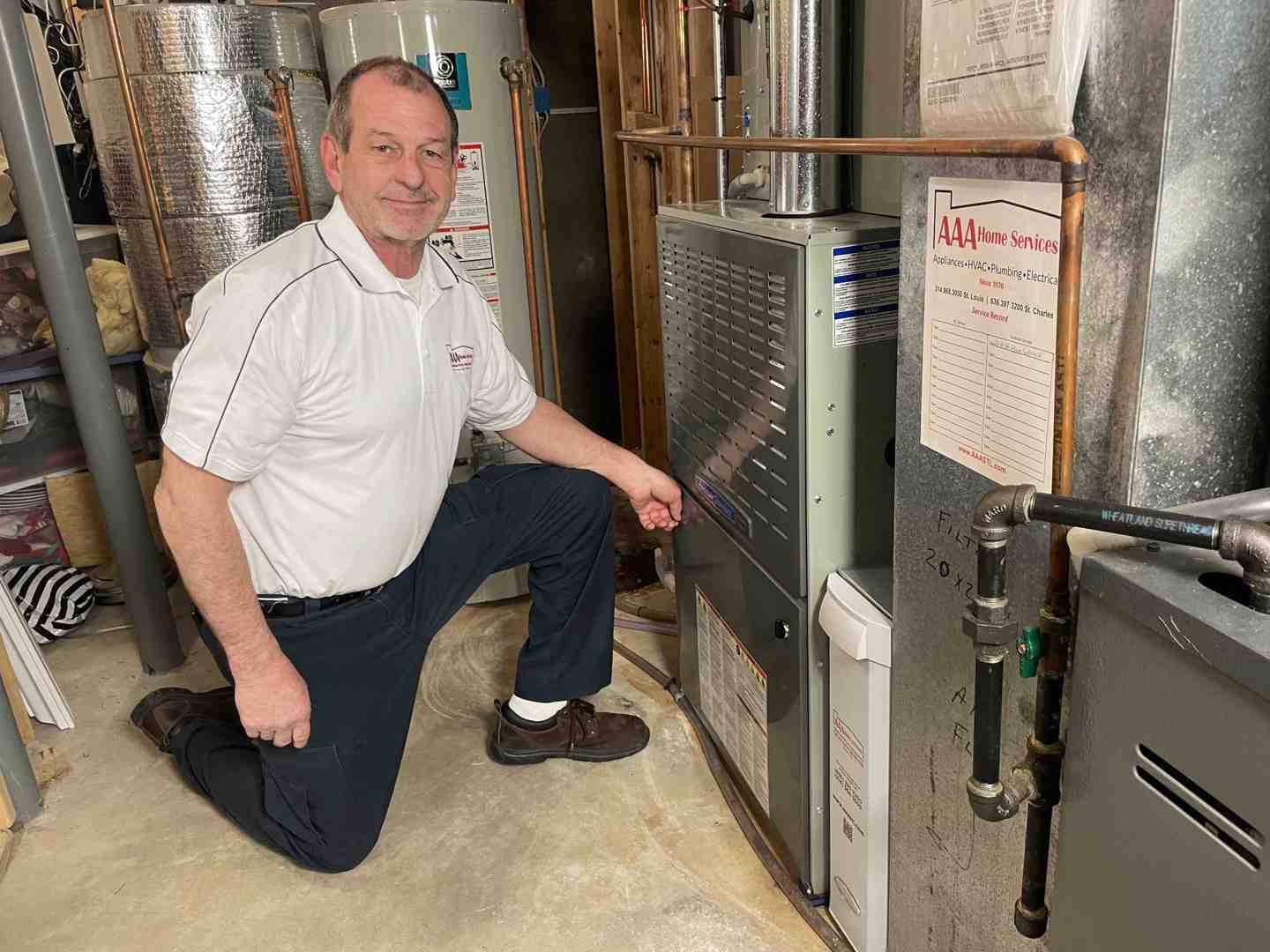 HVAC technician measuring ductwork for proper AC sizing - AC Installation Chesterfield HVAC technician measuring ductwork for proper AC sizing - AC Installation Chesterfield